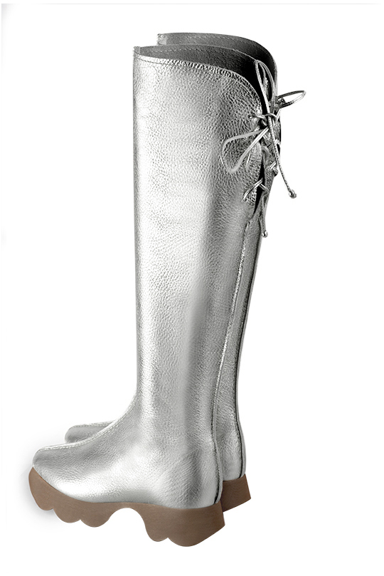 Light silver women's knee-high boots, with laces at the back. Round toe. Low rubber soles. Made to measure. Rear view - Florence KOOIJMAN